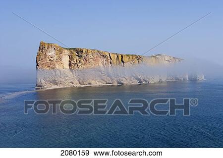 Perce Rock In The Fog In The Gaspesie Region; Perce, Quebec, Canada View Large Photo Image Stock Photo - Perce Rock In The Fog In The Gaspesie Region; Perce, Quebec, Canada. Fotosearch