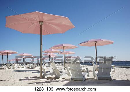 Pink Umbrellas And Muskoka Chairs On Sugar Beach Toronto Ontario