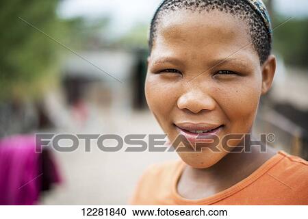 Stock Image - Portrait of a girl, San people; Ghanzi, Botswana. Fotosearch
