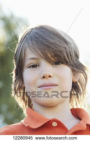 Stock Photography - Portrait of boy looking at camera; Toronto, Ontario, Canada. Fotosearch