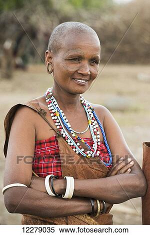 Portrait of Datoga woman with tattooed face and wearing traditional clothing and jewelry, near Lake Eyasi; Tanzania View Large Photo Image Stock Photography - Portrait of Datoga woman with tattooed face and wearing traditional clothing and jewelry, near Lake Eyasi; Tanzania. Fotosearch