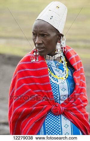 Portrait of Maasai woman wearing traditional clothing, beaded jewelry and beaded cap, Ngorongoro Conservation Area; Tanzania View Large Photo Image Stock Photo - Portrait of Maasai woman wearing traditional clothing, beaded jewelry and beaded cap, Ngorongoro Conservation Area; Tanzania. Fotosearch