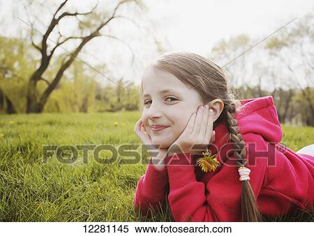 Stock Photography - Portrait of young girl at a park; Toronto, Ontario, Canada. Fotosearch