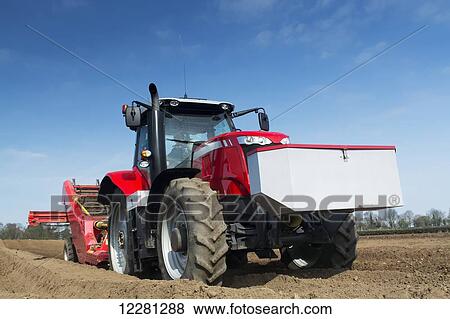 Preparing potato seed bed, using Grimme stone removing machine pulled by a Massey Ferguson 7620; Yorkshire, England View Large Photo Image Stock Photo - Preparing potato seed bed, using Grimme stone removing machine pulled by a Massey Ferguson 7620; Yorkshire, England. Fotosearch