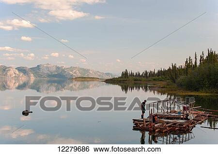 Stock Photograph - Raft under construction in the bay of Lake Laberge near Whitehorse, Yukon Territory, Canada. Fotosearch