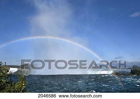 Stock Photograph - Rainbow In The Mist Over Niagara Falls, Ontario, Canada. Fotosearch