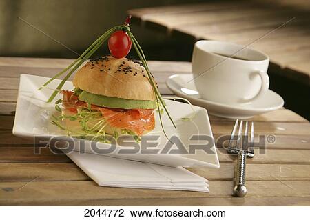 Salmon On A Bun With Veggies, Coffee Cup And Place Setting On Wooden Table Top View Large Photo Image Stock Image - Salmon On A Bun With Veggies, Coffee Cup And Place Setting On Wooden Table Top. Fotosearch