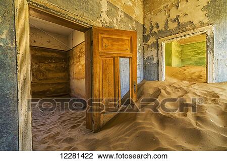 Sand in the rooms of a colourful and abandoned house; Kolmanskop, Namibia View Large Photo Image Stock Image - Sand in the rooms of a colourful and abandoned house; Kolmanskop, Namibia. Fotosearch