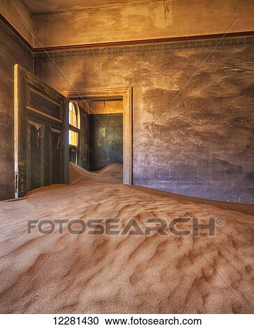 Sand in the rooms of a colourful and abandoned house; Kolmanskop, Namibia View Large Photo Image Stock Image - Sand in the rooms of a colourful and abandoned house; Kolmanskop, Namibia. Fotosearch