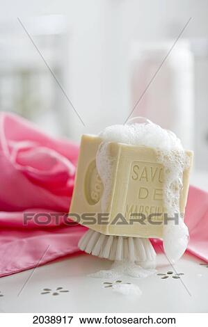 Stock Photo - Shave Brush With Soap Suds On A Bathroom Counter. Fotosearch