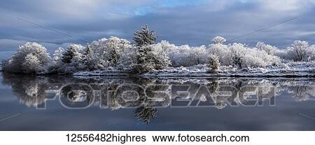 Stock Photograph - Snow lingers on a peaceful winter morning at Lewis and Clark National Historical Park; Astoria, Oregon, United States of America. Fotosearch