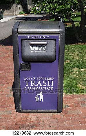 Stock Image - Solar powered trash compactor on the sidewalk; Newport, Rhode Island, United States of America. Fotosearch