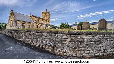 St. Wilfrid's Church in the village of Monk Fryston, North Yorkshire. The church dates largely to the thirteenth century, although the lower portion of the church tower is Anglo-Saxon in origin; Monk Fryston, North Yorkshire, England View Large Photo Image Stock Photograph - St. Wilfrid's Church in the village of Monk Fryston, North Yorkshire. The church dates largely to the thirteenth century, although the lower portion of the church tower is Anglo-Saxon in origin; Monk Fryston, North Yorkshire, England. Fotosearch
