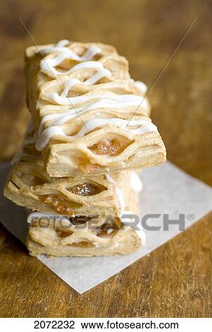 Stack Of Fruit Pastries With Icing On Wood Table View Large Photo Image Stock Image - Stack Of Fruit Pastries With Icing On Wood Table. Fotosearch