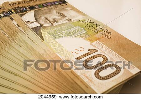 Stack Of Ten Thousand Dollars In Canadian One Hundred Dollar Currency Stock Photo Fotosearch