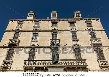 Statue of Marko Marulic, father of Croatian literature, by Ivan Mestrovic in front of the Milesi Palace in Fruit Square; Split, Croatia View Large Photo Image Stock Photograph - Statue of Marko Marulic, father of Croatian literature, by Ivan Mestrovic in front of the Milesi Palace in Fruit Square; Split, Croatia. Fotosearch