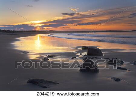 Sunrise On A Beach Near The Port Bickerton Lighthouse, Eastern Shore Of Nova Scotia View Large Photo Image Stock Photo - Sunrise On A Beach Near The Port Bickerton Lighthouse, Eastern Shore Of Nova Scotia. Fotosearch