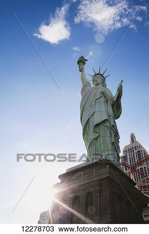 Stock Image - Sunset flare over the New York, New York Hotel and Casino; Las Vegas, Nevada, United States of America. Fotosearch