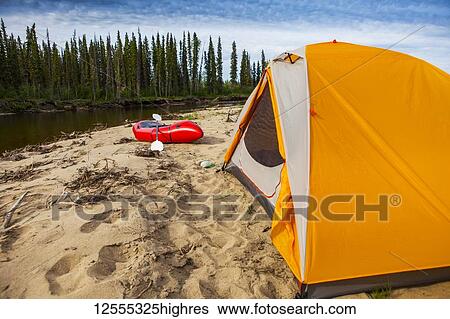 Tent and packraft on sandy beach on the Charley River on a sunny day, YukonCharley Rivers National Preserve; Alaska, United States of America View Large Photo Image Stock Photograph - Tent and packraft on sandy beach on the Charley River on a sunny day, YukonCharley Rivers National Preserve; Alaska, United States of America. Fotosearch