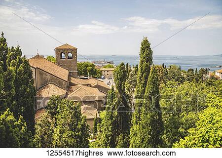 Terracotta tiled roof of a building and a view of the Adriatic Sea; Trieste, Friuli Venezia Giulia, Italy View Large Photo Image Stock Photograph - Terracotta tiled roof of a building and a view of the Adriatic Sea; Trieste, Friuli Venezia Giulia, Italy. Fotosearch