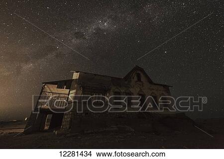 The Milky way above an abandoned house; Kolmanskop, Namibia View Large Photo Image Picture - The Milky way above an abandoned house; Kolmanskop, Namibia. Fotosearch