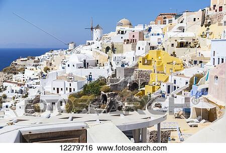 The town of Oia showing the traditional windmill and whitewashed village buildings; Satorini, Greek Islands, Greece View Large Photo Image Stock Photograph - The town of Oia showing the traditional windmill and whitewashed village buildings; Satorini, Greek Islands, Greece. Fotosearch
