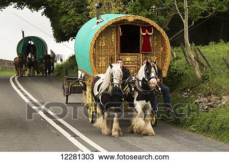 Traditional gypsy horse drawn caravan on road heading towards Appleby Horse Fair; Cumbria, England View Large Photo Image Stock Image - Traditional gypsy horse drawn caravan on road heading towards Appleby Horse Fair; Cumbria, England. Fotosearch