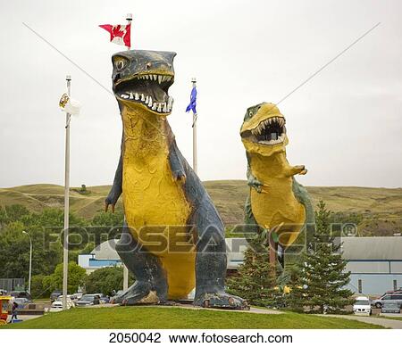 Stock Image - Two Large Dinosaur Figures, Drumheller, Alberta. Fotosearch