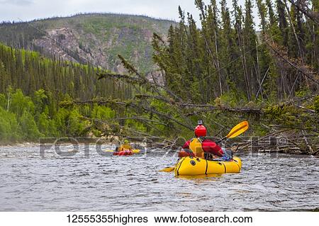 Two women packrafters negotiating a tributary of the Charley River in summertime, YukonCharley Rivers National Preserve; Alaska, United States of America View Large Photo Image Stock Photograph - Two women packrafters negotiating a tributary of the Charley River in summertime, YukonCharley Rivers National Preserve; Alaska, United States of America. Fotosearch