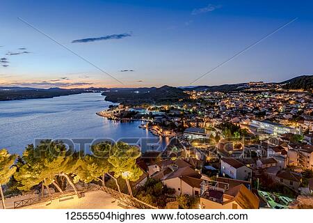 Stock Photograph - View of the city of Sibenik at night from St Michael's Fortress; Sibenik, Croatia. Fotosearch