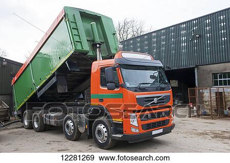 Stock Photo - Wagon delivering a bulk load of livestock feed to a farm; Cumbria, England. Fotosearch