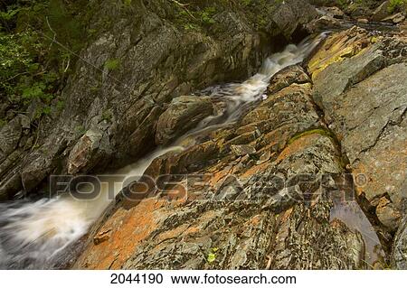Waterfall And Spring Pollen Stained Rocks Near Sleepy Cove On Grand Lake, Nova Scotia View Large Photo Image Stock Image - Waterfall And Spring Pollen Stained Rocks Near Sleepy Cove On Grand Lake, Nova Scotia. Fotosearch