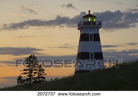 Stock Photo - West Point Lighthouse At Sunset, Prince Edward Island. Fotosearch