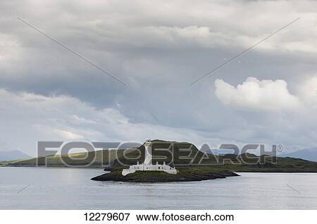 Stock Photo - White lighthouse along the coast; Scotland. Fotosearch