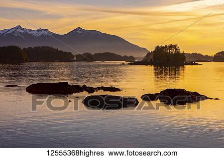 Stock Photograph - Winter sunset looking over Crescent Bay; Sitka, Alaska, United States of America. Fotosearch