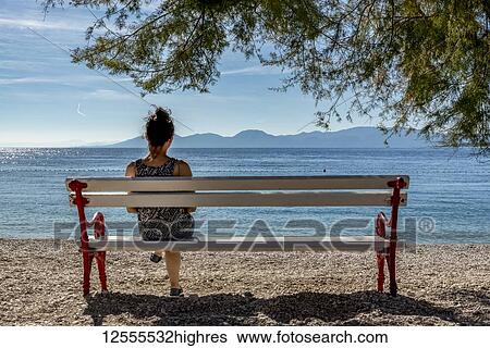 Woman enjoying the view of the Makarska Riviera; Dalmatia, Croatia View Large Photo Image Stock Photograph - Woman enjoying the view of the Makarska Riviera; Dalmatia, Croatia. Fotosearch