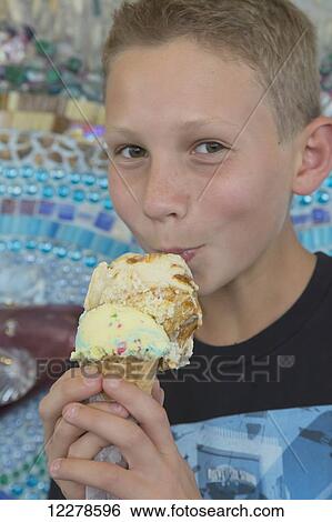 A boy eating an ice cream cone at Campland on the Bay, Pacific Beach; San Diego, California, United States of America View Large Photo Image Stock Photograph - A boy eating an ice cream cone at Campland on the Bay, Pacific Beach; San Diego, California, United States of America. Fotosearch