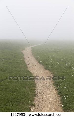 Picture - A dirt path in the fog; South Shields, Tyne and Wear, England. Fotosearch