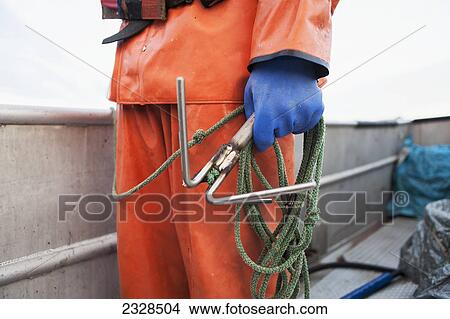 A Grappling Hook, An Important Tool On A Commercial Halibut Fishing Boat; Southwest Alaska, United States Of America View Large Photo Image Picture - A Grappling Hook, An Important Tool On A Commercial Halibut Fishing Boat; Southwest Alaska, United States Of America. Fotosearch