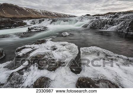 A Waterfall, Laxa I Fjos, Along The Highway In The Rural Areas Of Iceland; Iceland View Large Photo Image Stock Photo - A Waterfall, Laxa I Fjos, Along The Highway In The Rural Areas Of Iceland; Iceland. Fotosearch