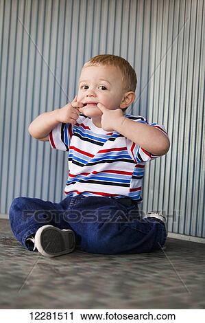 A young boy making a silly face; Nashville, Tennessee, United States of America View Large Photo Image Stock Image - A young boy making a silly face; Nashville, Tennessee, United States of America. Fotosearch