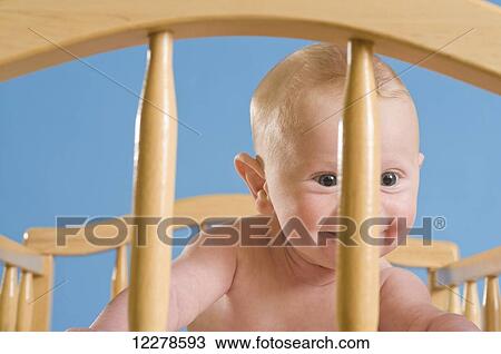 Stock Image - Baby on a changing table; Portland, Oregon, United States of America. Fotosearch