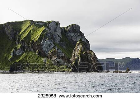 Cape Pankof On Unimak Island In The Pacific Ocean Near The Entrance To False Pass, Also Known As Isanotski Strait; Alaska, United States Of America View Large Photo Image Stock Photo - Cape Pankof On Unimak Island In The Pacific Ocean Near The Entrance To False Pass, Also Known As Isanotski Strait; Alaska, United States Of America. Fotosearch