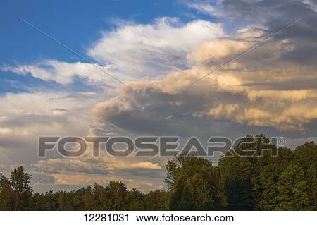 Stock Image - Clouds at sunset; Waterloo, Quebec, Canada. Fotosearch