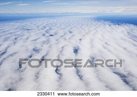 Stock Image - Clouds Over Cook Inlet; Alaska, United States Of America. Fotosearch