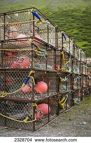 Picture - Commercial Crab Fishing Pots Stored At The Port Of King Cove, Alaska Peninsula; Southwest Alaska, United States Of America. Fotosearch