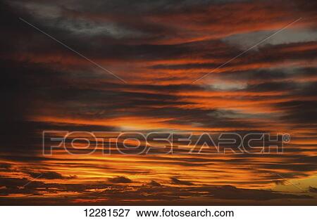 Stock Photo - Dramatic red sky with clouds; Caloundra, Queensland, Australia. Fotosearch