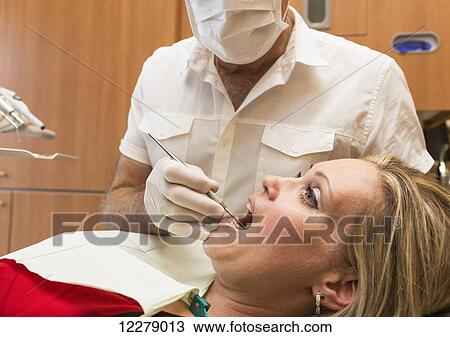 Female patient at dental appointment; Edmonton, Alberta, Canada View Large Photo Image Stock Image - Female patient at dental appointment; Edmonton, Alberta, Canada. Fotosearch