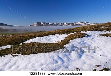 Freezing fog lingering in valley bottoms on a winter morning, looking towards the Howgill Fells; Cumbria, England View Large Photo Image Stock Photo - Freezing fog lingering in valley bottoms on a winter morning, looking towards the Howgill Fells; Cumbria, England. Fotosearch