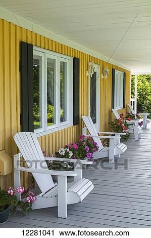 Front porch with adirondack chairs and geraniums; East Farnham, Quebec, Canada View Large Photo Image Stock Image - Front porch with adirondack chairs and geraniums; East Farnham, Quebec, Canada. Fotosearch